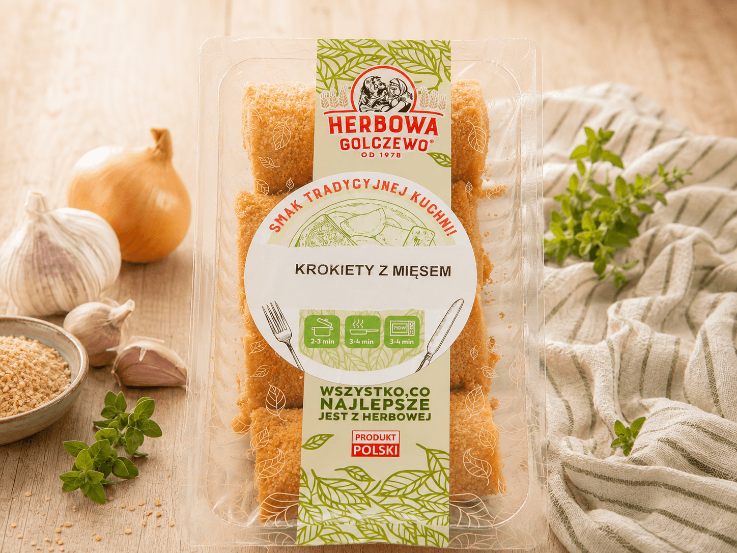 Krokiety z mięsem Herbowa — zamknięte przezroczyste opakowanie z dodatkami zgodnymi ze składem.