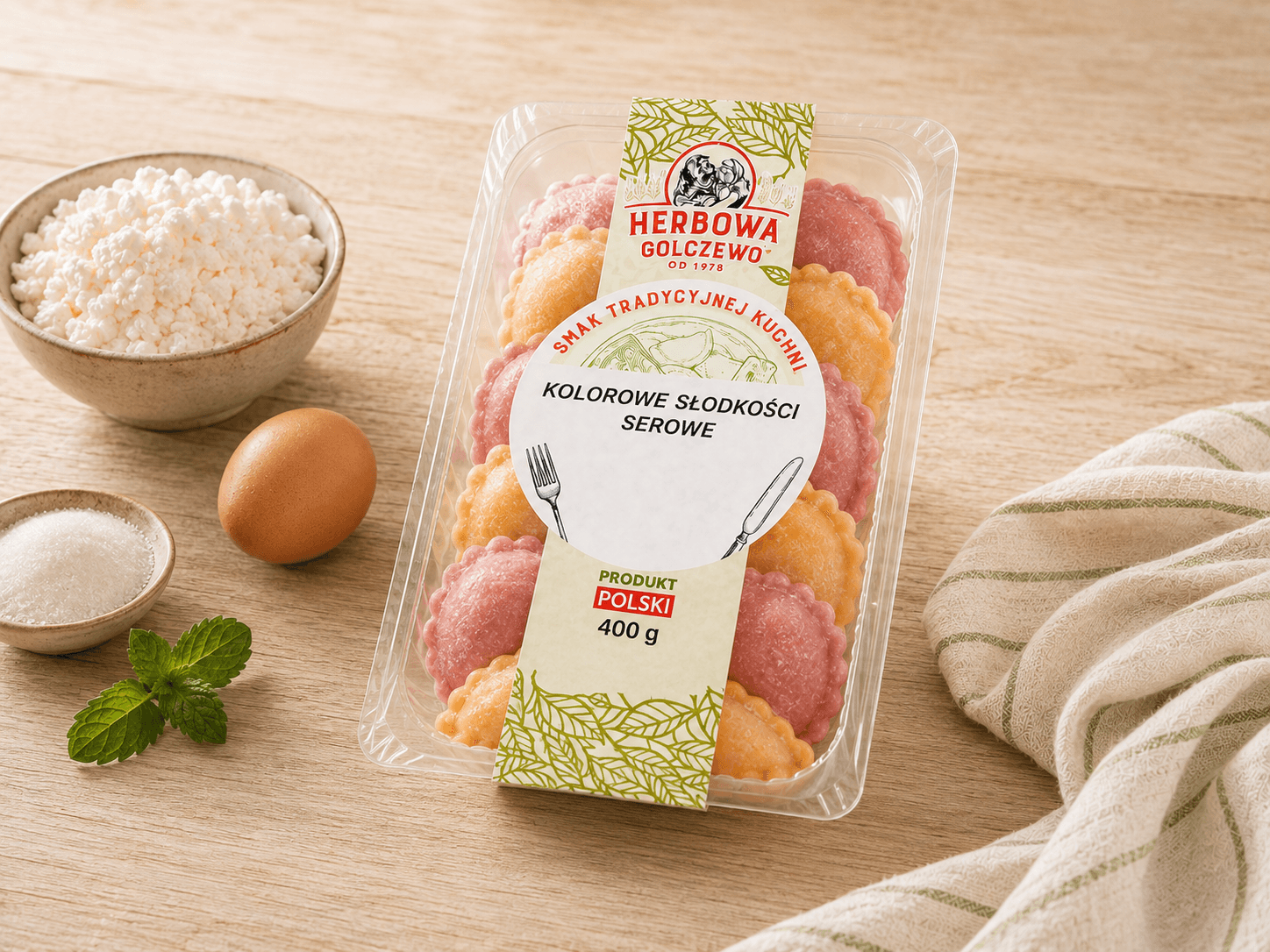 Kolorowe słodkości serowe Herbowa — wizualizacja tymczasowa zamkniętego opakowania, przygotowana bez rzeczywistego zdjęcia produktu. Do zastąpienia po dostarczeniu fotografii.
